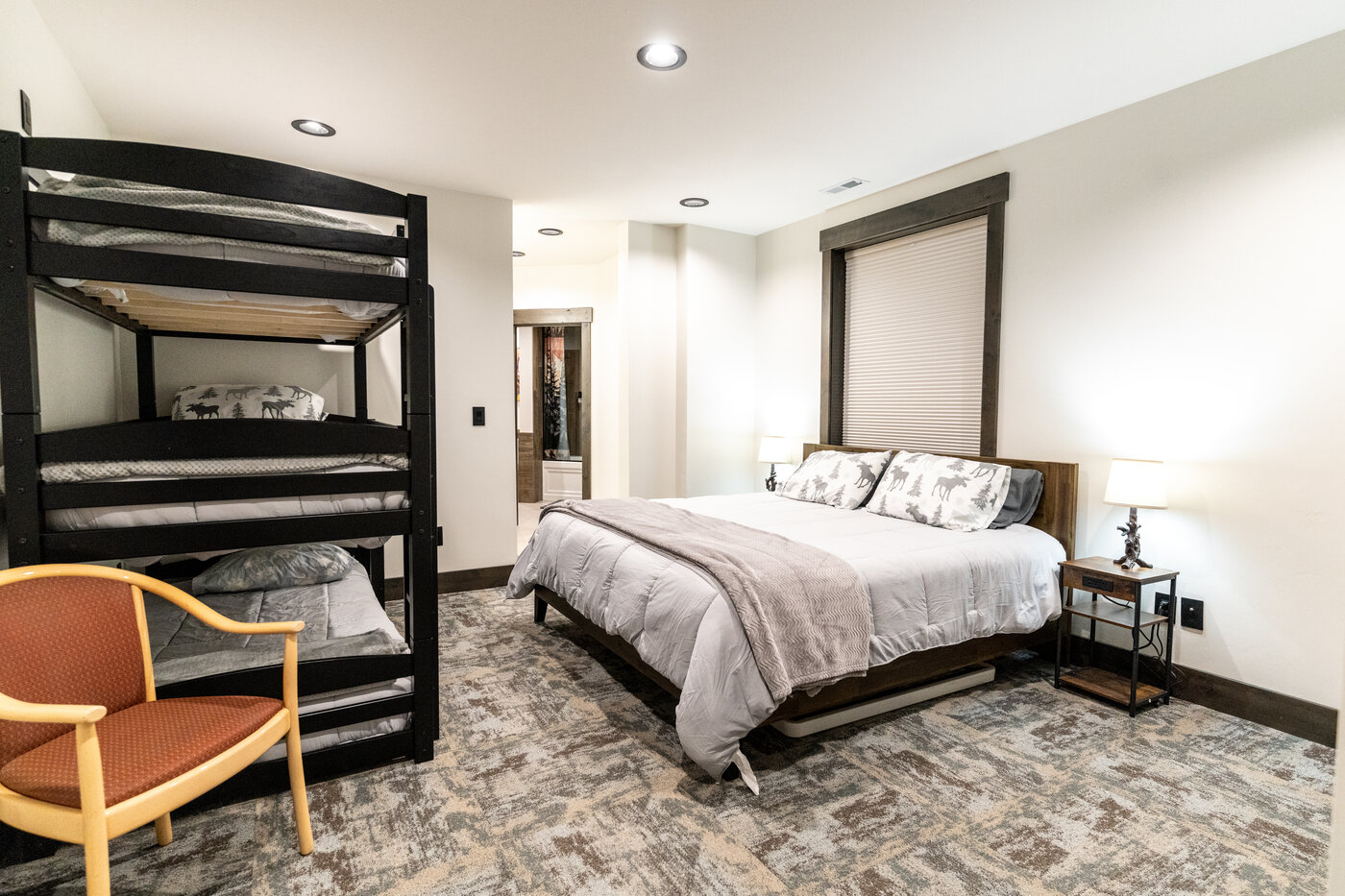 Beautiful Views — bedroom with king bed and matching twin-over-twin metal bunks
