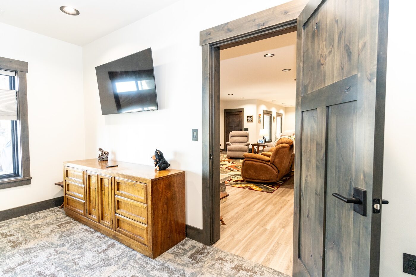 Beautiful Views — bedroom with TV and dresser opening into the living area