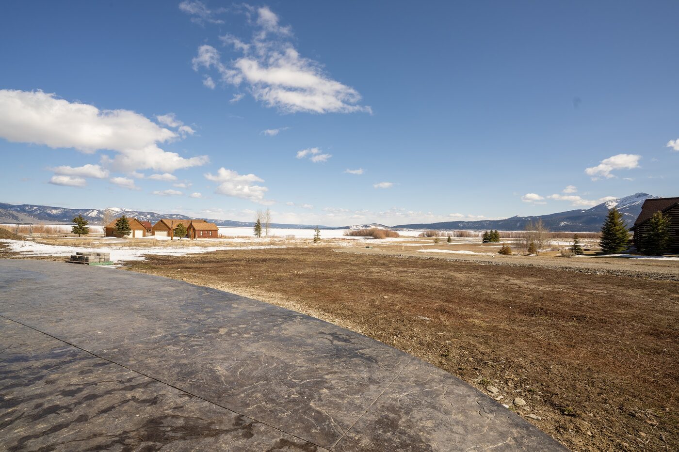 Beautiful Views — back patio looking out across the lawn to Henry's Lake and the Centennial Range