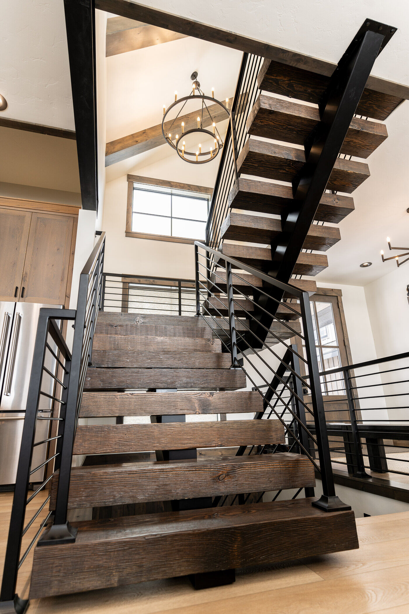 Lodge at Cutthroat Landing — reclaimed-wood floating staircase with steel-cable railing