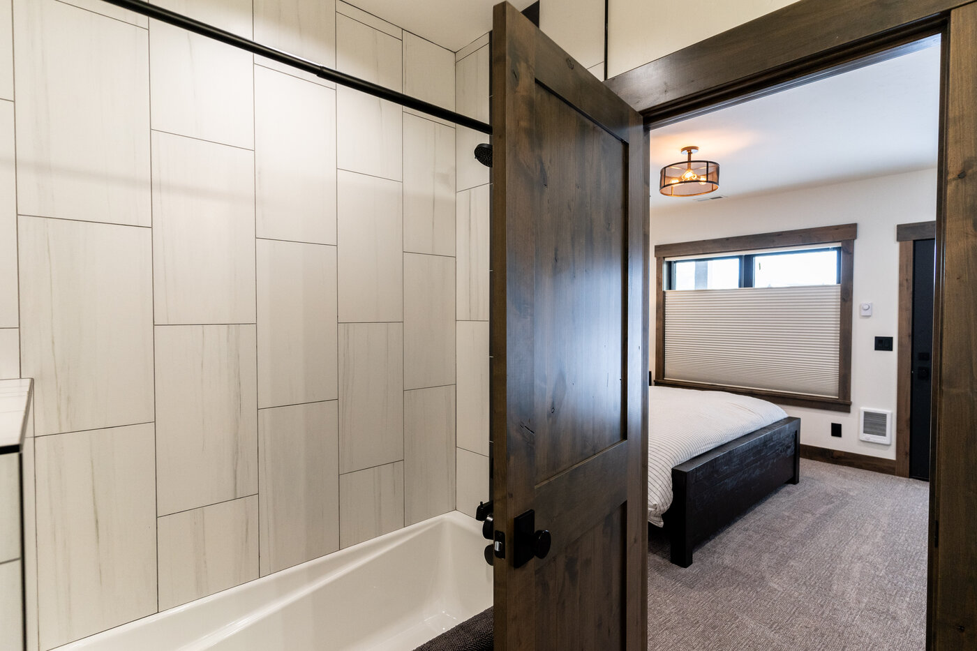 Lodge at Cutthroat Landing — secondary bathroom with subway-tile shower and tub combination