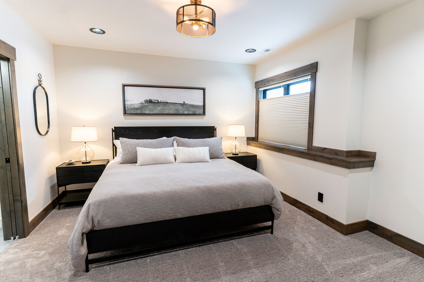 Lodge at Cutthroat Landing — king bedroom with modern art and black-framed bed