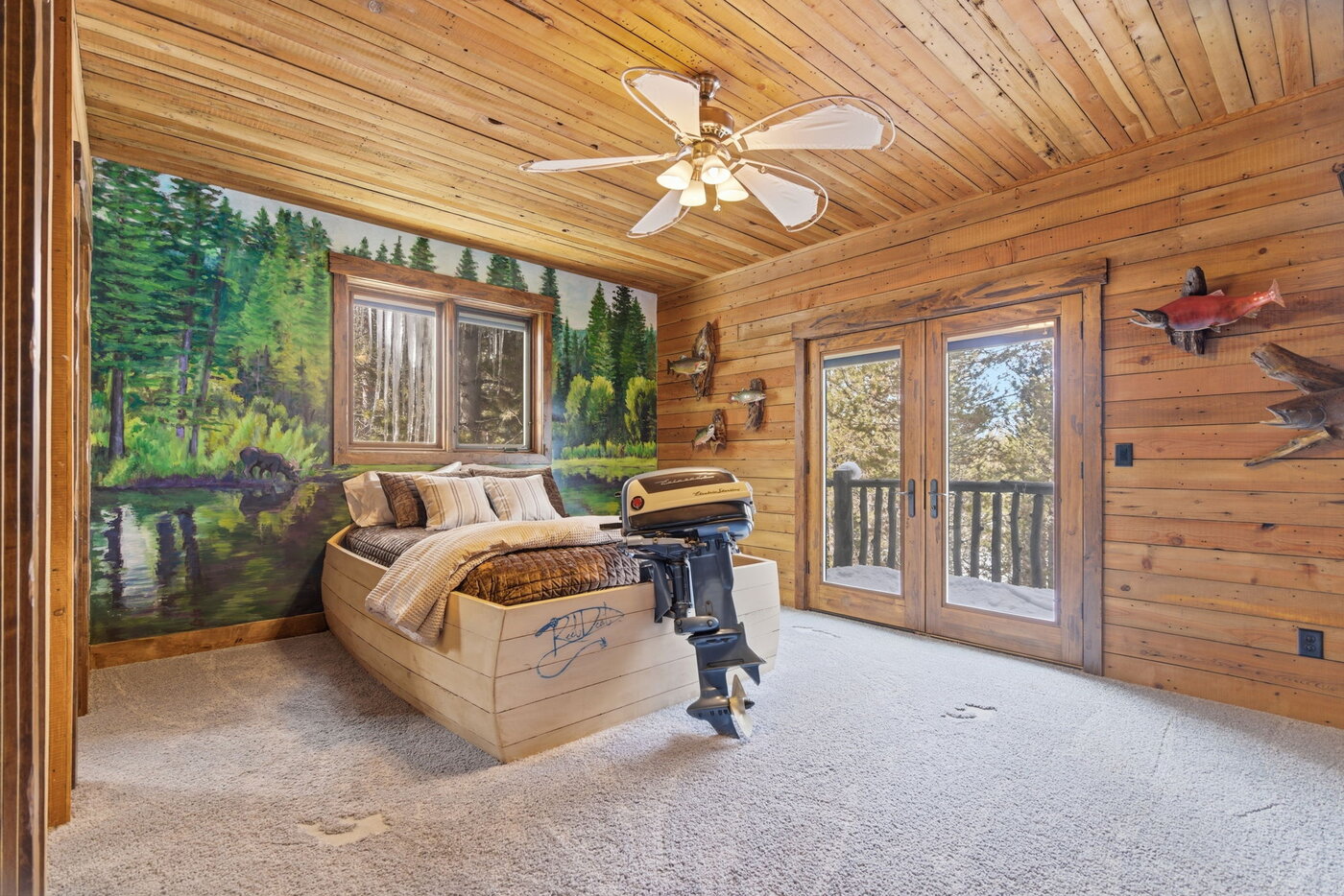 Riverfront Wildlife Lodge — kids bedroom with boat-shaped bed and hand-painted lake mural