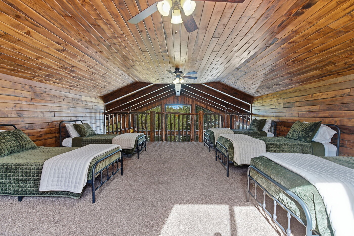 Riverfront Wildlife Lodge — bunk loft looking down to the railing and great room window