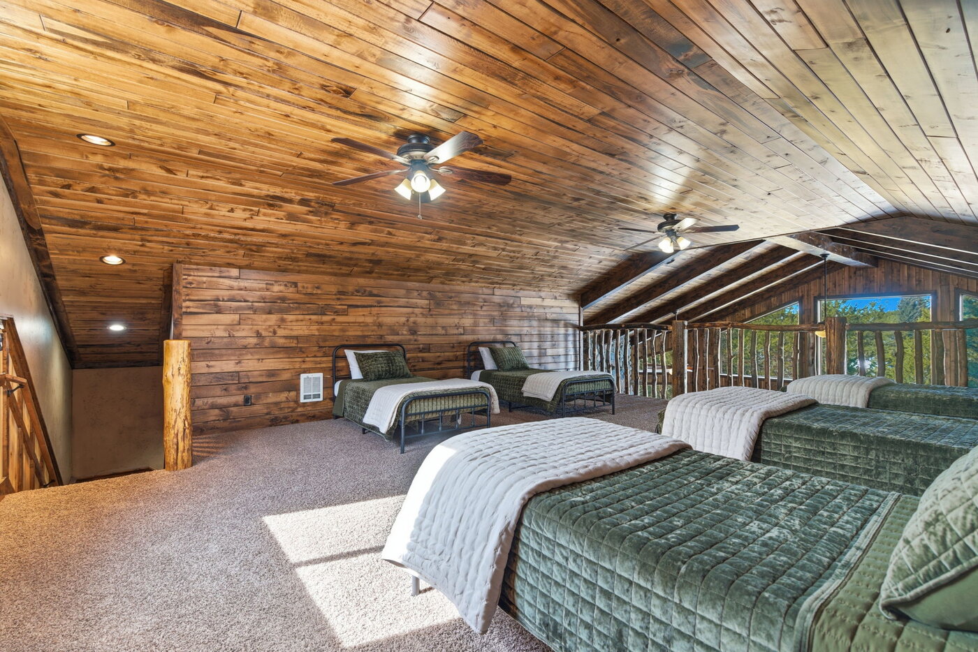 Riverfront Wildlife Lodge — bunk loft alternate angle showing additional beds and seating