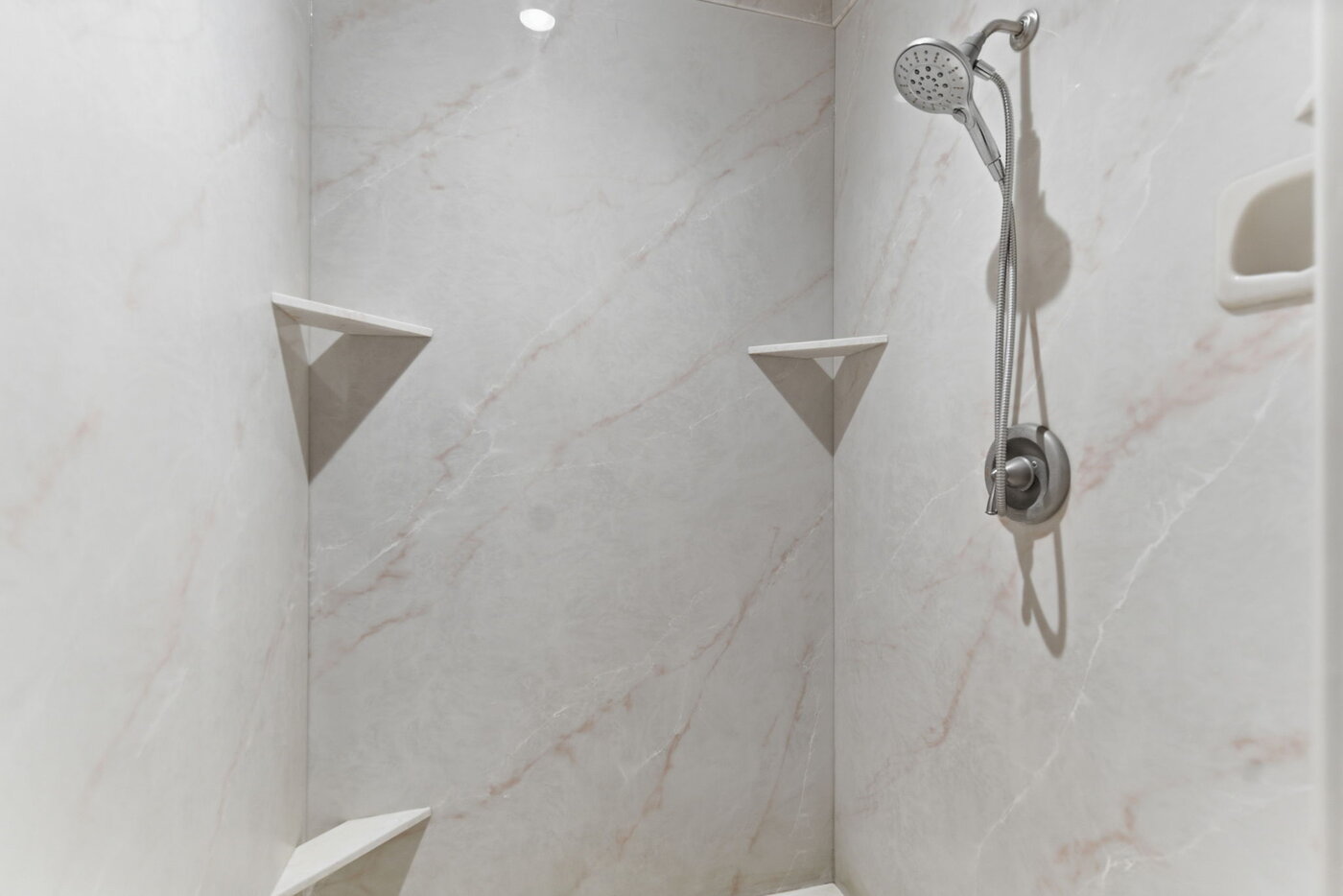 Riverfront Wildlife Lodge — primary bathroom with marble walk-in shower