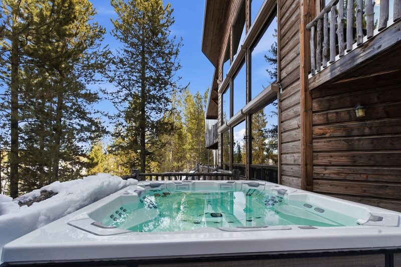 Private hot tub at Riverfront Wildlife Lodge overlooking the Henry's Fork in Island Park, Idaho