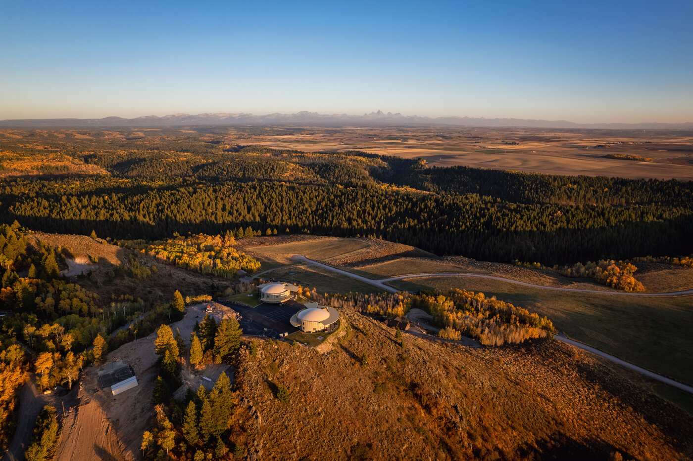 Teton View Retreat — Both Domes — twin domes with the full Teton range visible on the horizon