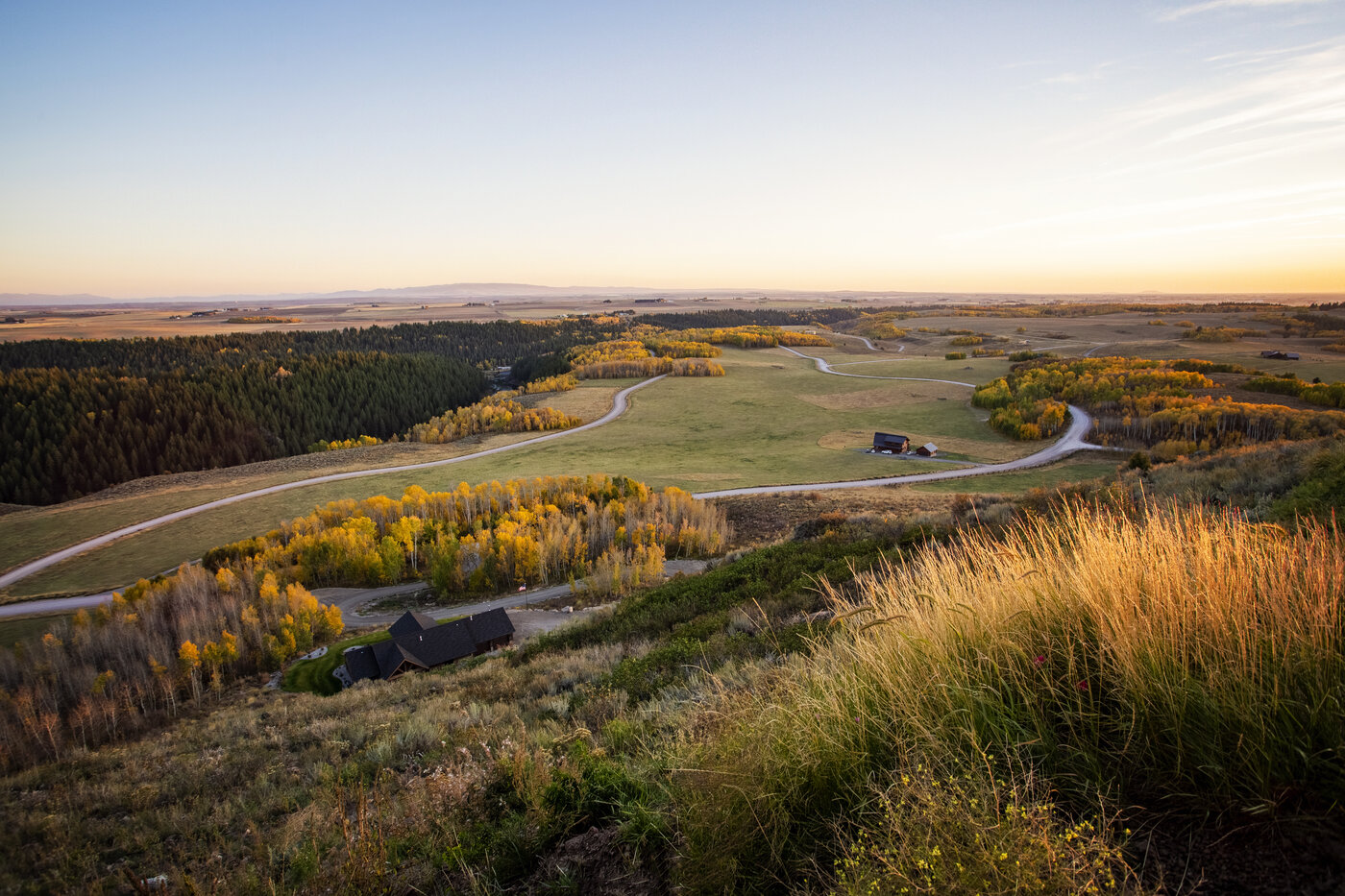 Teton View Retreat — Both Domes — sunset over the valley fields seen from the ridge