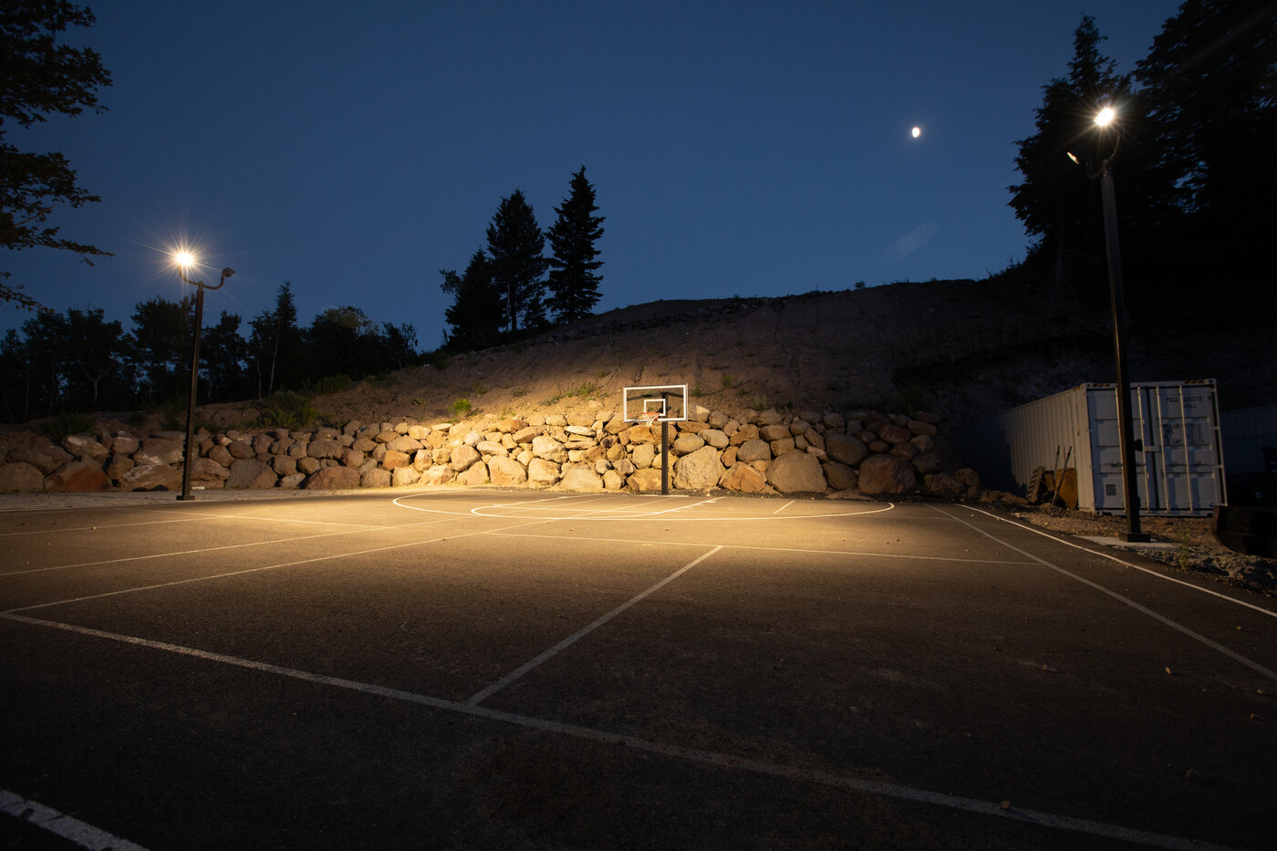 Teton View Retreat — Both Domes — lit basketball court at night with the moon overhead