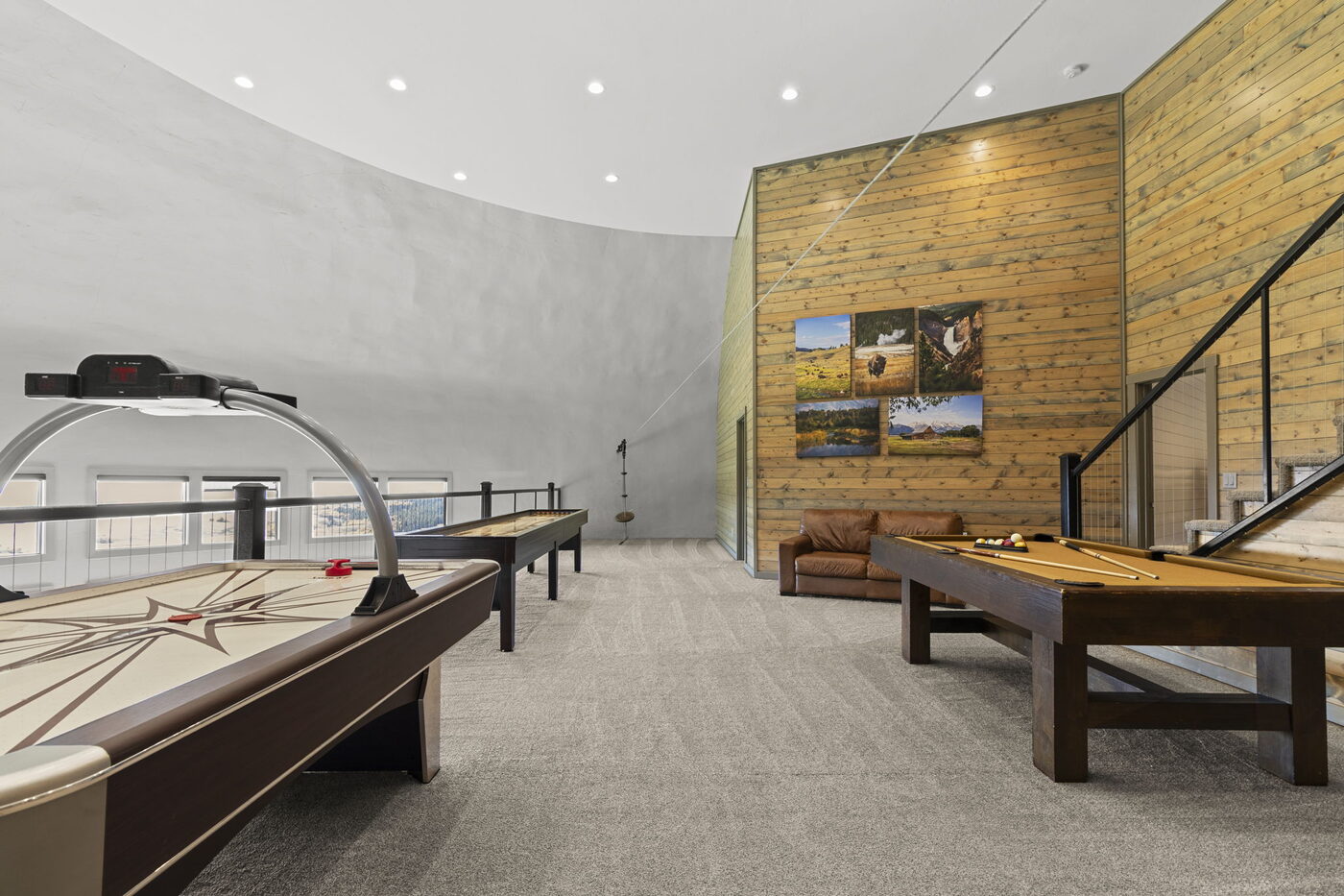 Teton View Retreat — Both Domes — game room with the curved dome wall, shuffleboard table, and pool table