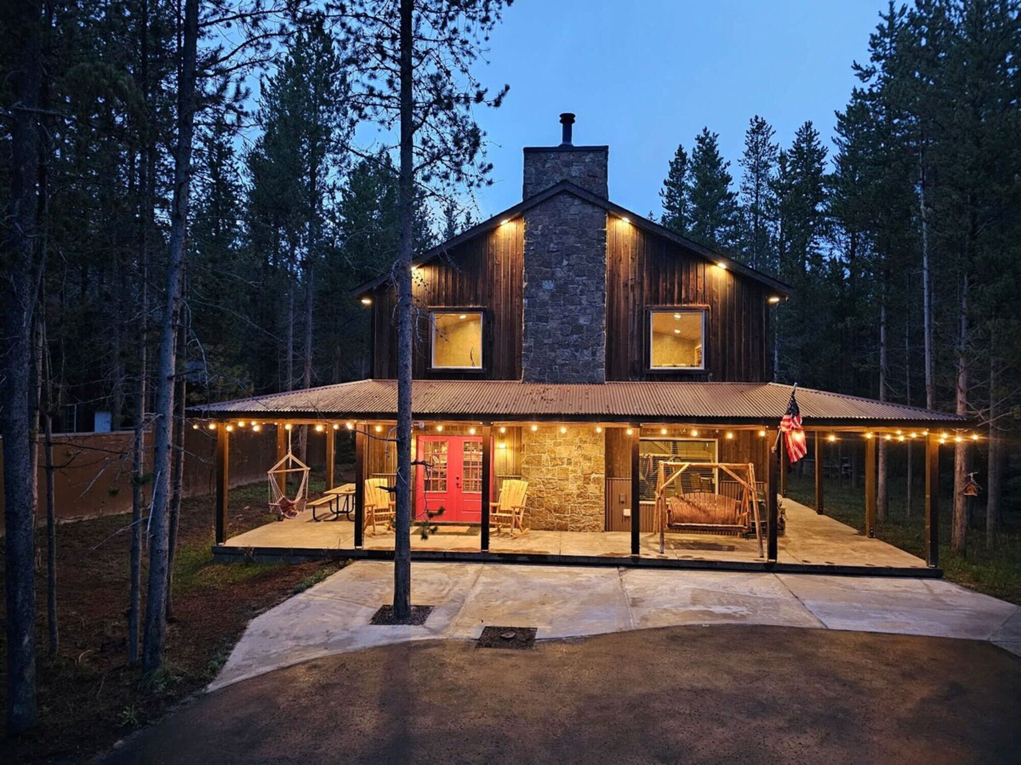 Trails End Lodge — Bills Island cabin lit at dusk